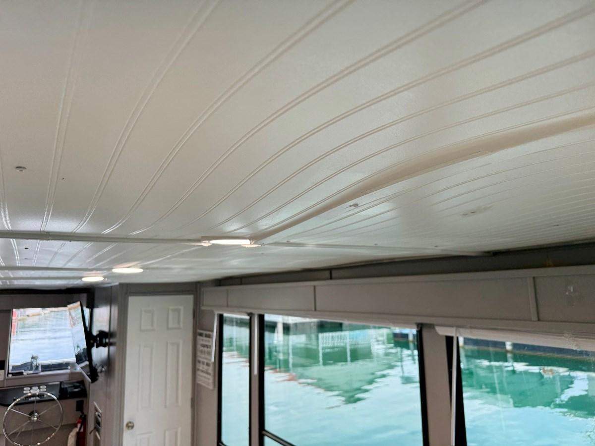 a room with a pool table and a television aboard 2012 MAJESTIC 16 X 75WB HOUSEBOAT NLSD Yacht for Sale