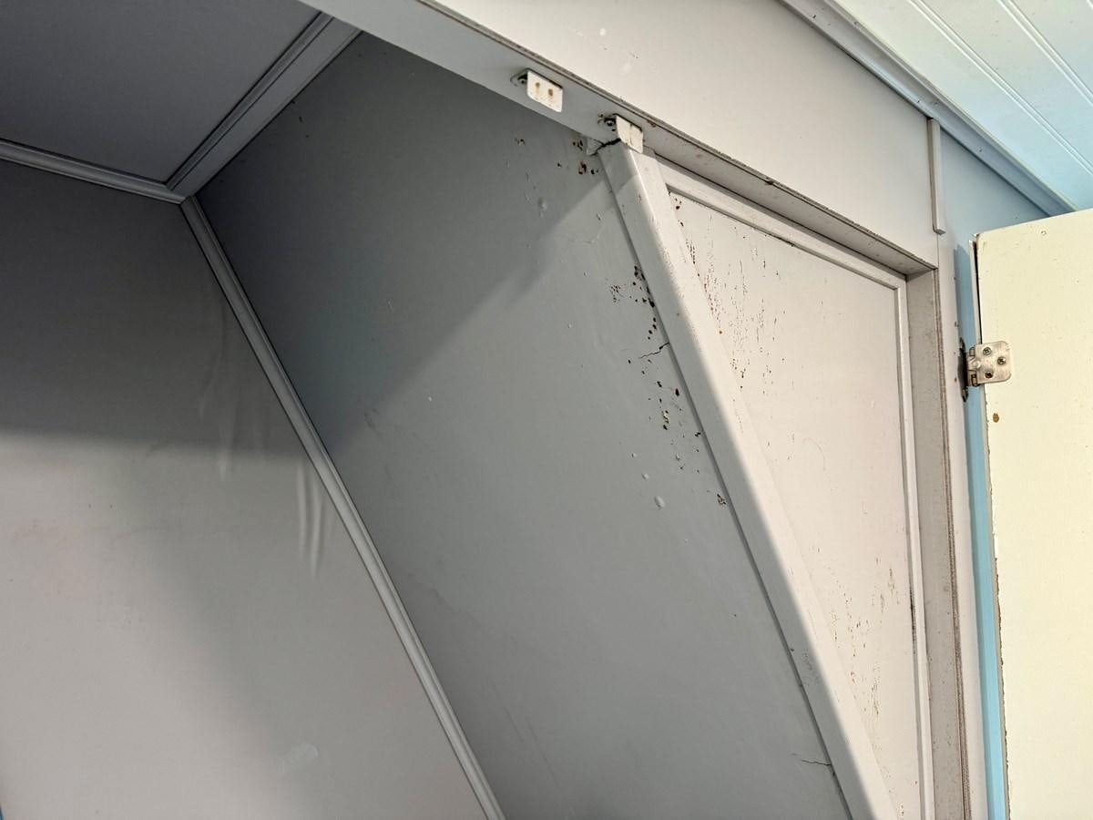 a white door with a handle aboard 2012 MAJESTIC 16 X 75WB HOUSEBOAT NLSD Yacht for Sale