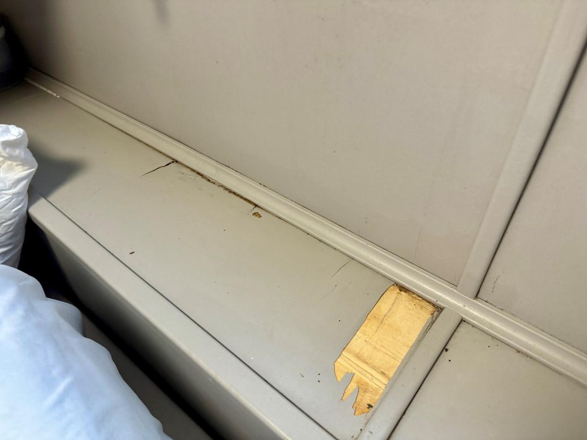 a white wall with a yellow block aboard 2012 MAJESTIC 16 X 75WB HOUSEBOAT NLSD Yacht for Sale