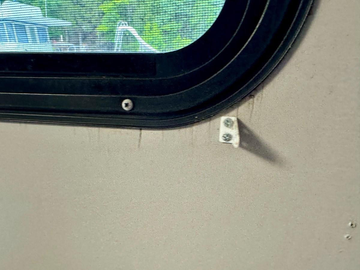 a black object on a white surface aboard 2012 MAJESTIC 16 X 75WB HOUSEBOAT NLSD Yacht for Sale