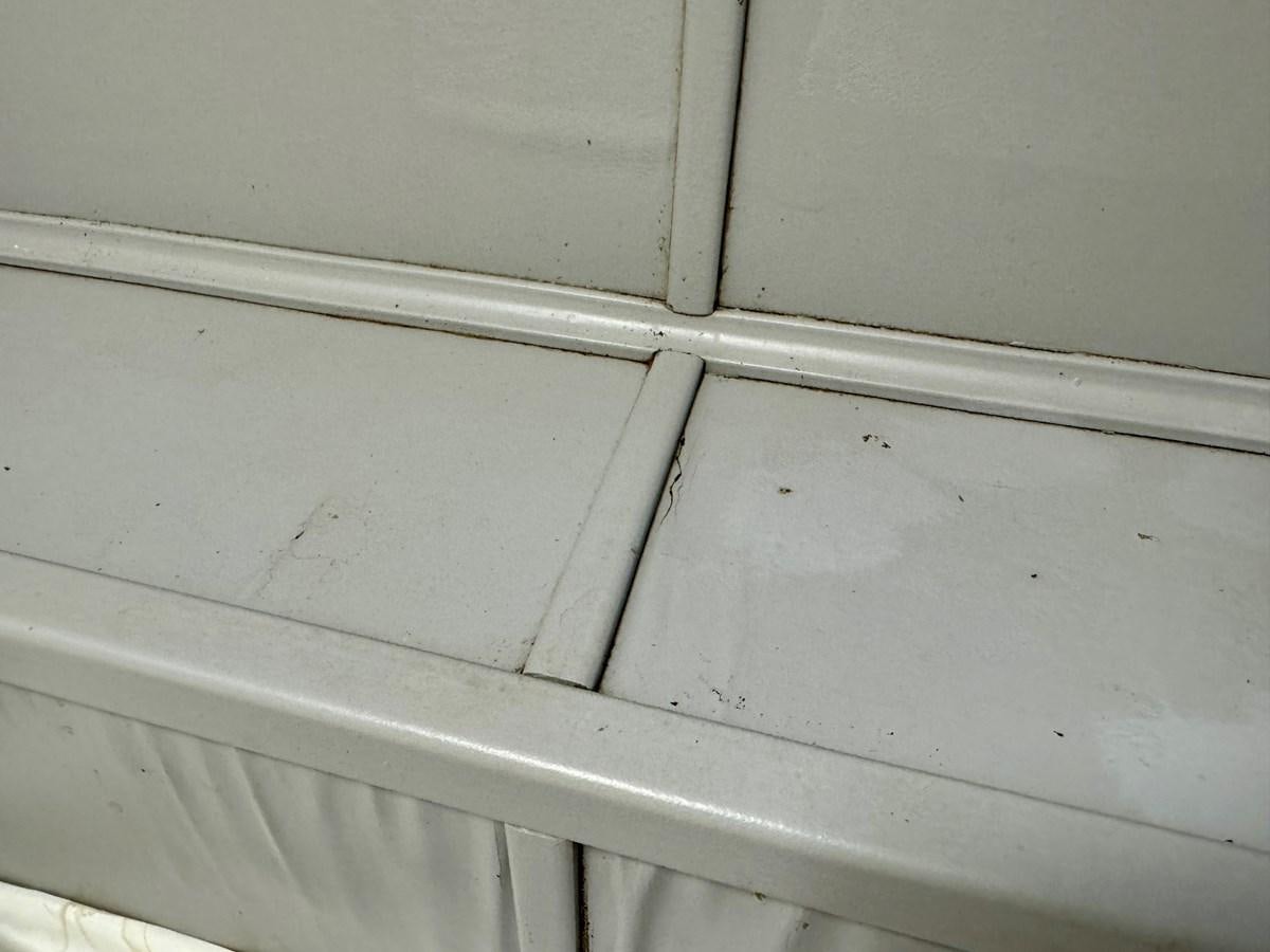 a white wall with a hole in it aboard 2012 MAJESTIC 16 X 75WB HOUSEBOAT NLSD Yacht for Sale