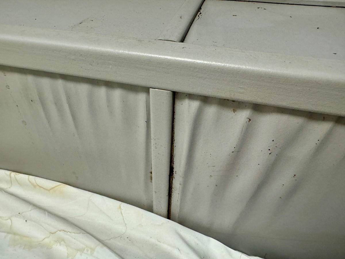 a white wall with a hole in it aboard 2012 MAJESTIC 16 X 75WB HOUSEBOAT NLSD Yacht for Sale