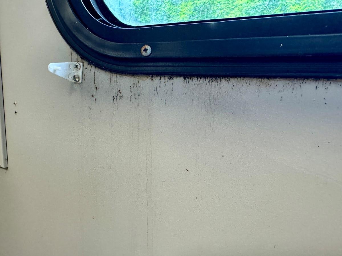 a black object on a white surface aboard 2012 MAJESTIC 16 X 75WB HOUSEBOAT NLSD Yacht for Sale