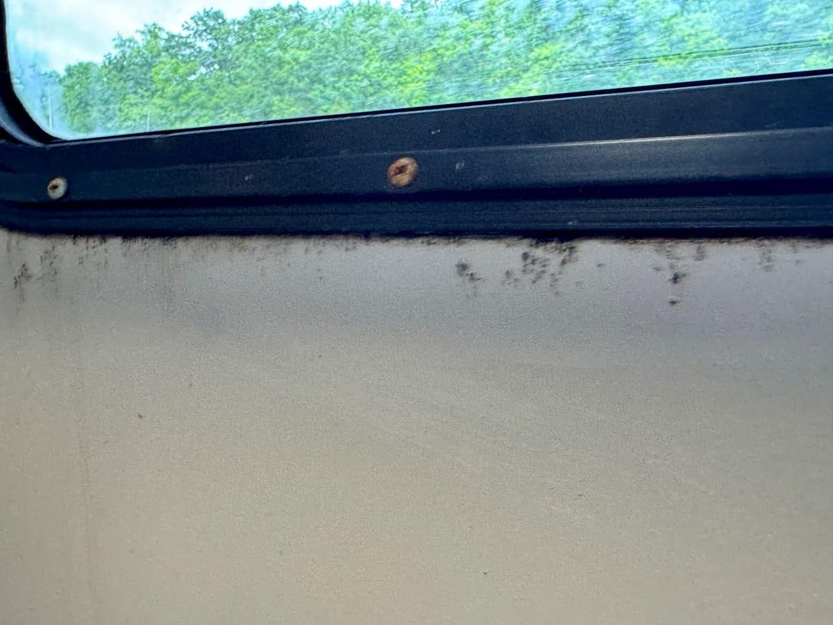 a close-up of a window aboard 2012 MAJESTIC 16 X 75WB HOUSEBOAT NLSD Yacht for Sale