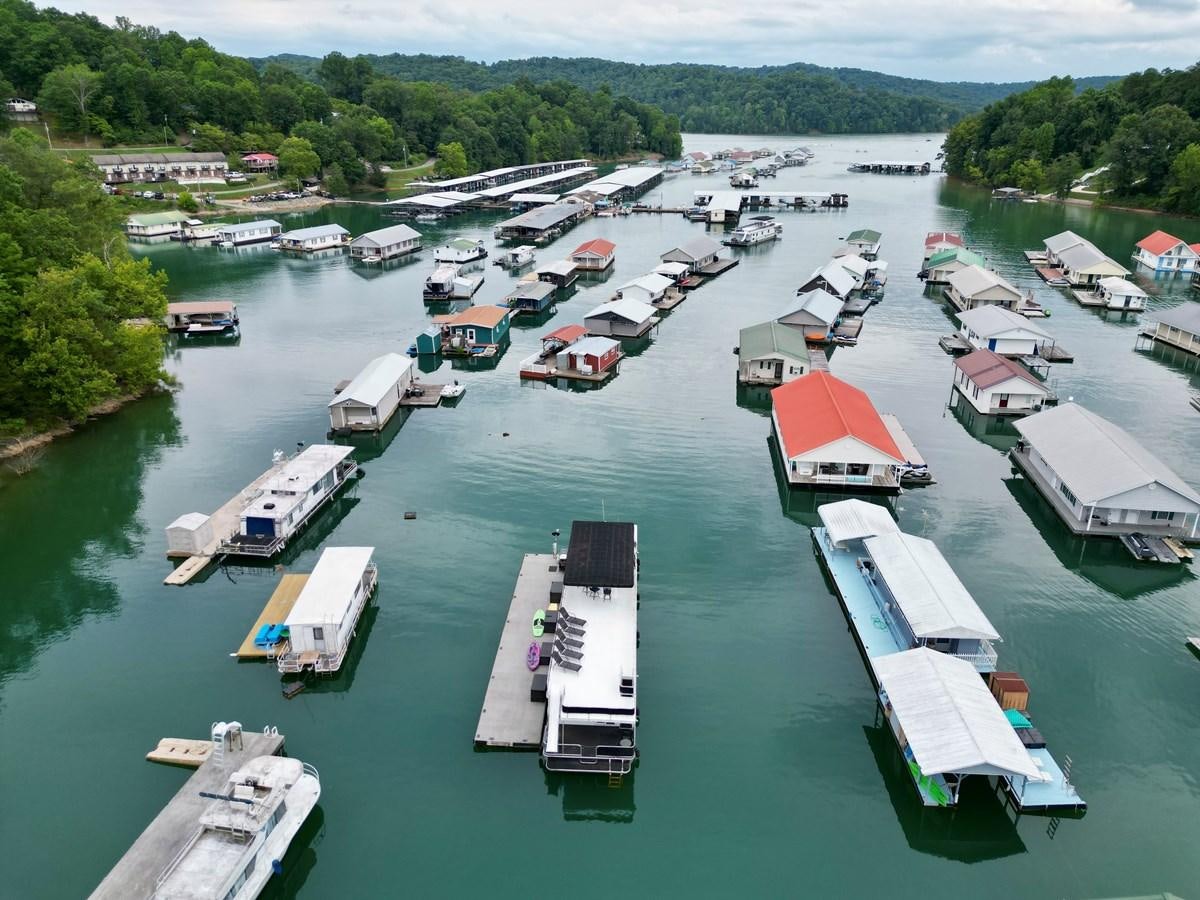 a large group of boats are parked in a harbor aboard 2012 MAJESTIC 16 X 75WB HOUSEBOAT NLSD Yacht for Sale