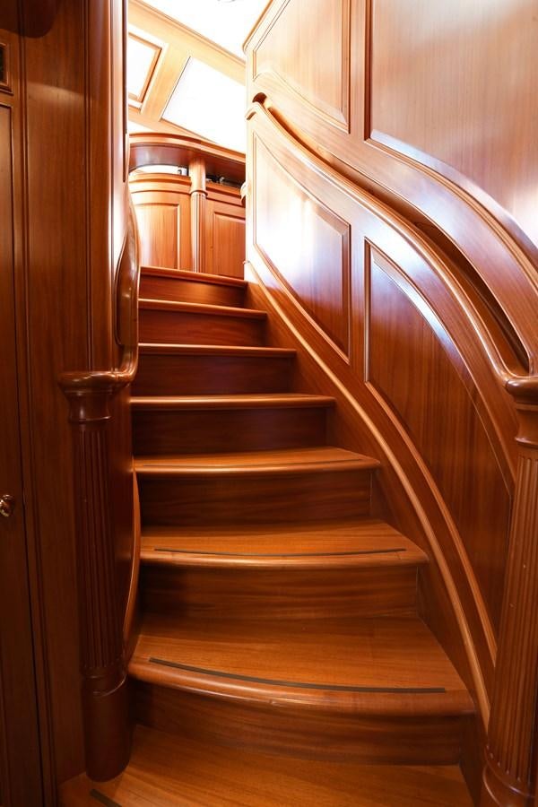 a wooden staircase in a house aboard ANNE Yacht for Sale