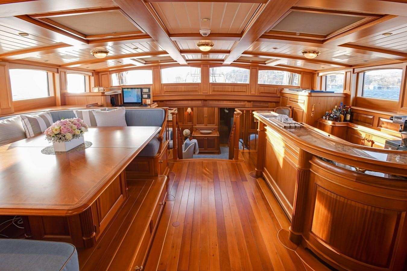 a large kitchen with wooden cabinets aboard ANNE Yacht for Sale