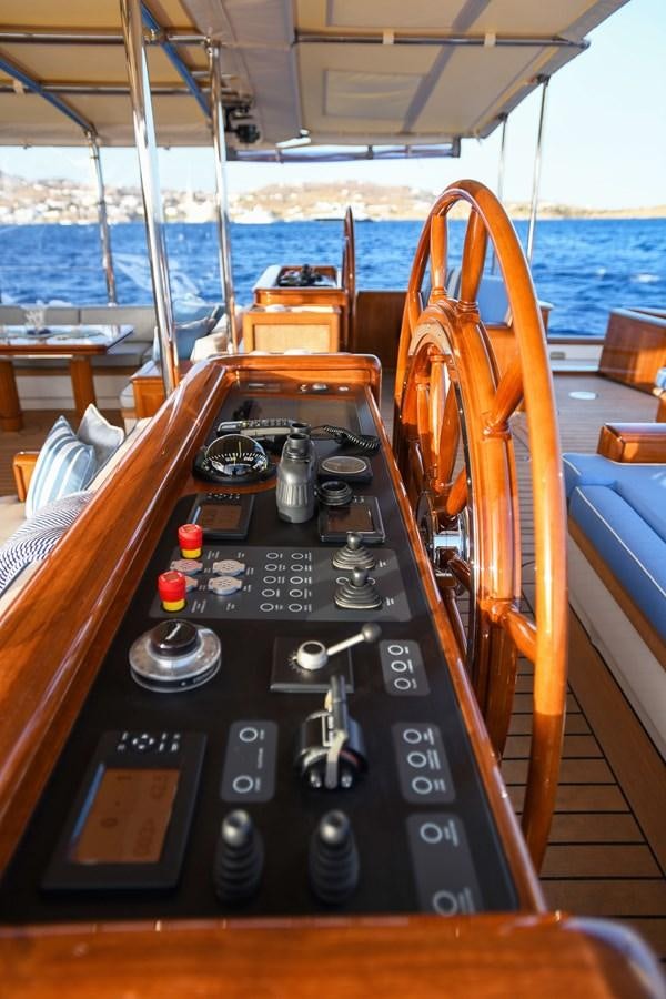 a wooden boat with a radio aboard ANNE Yacht for Sale
