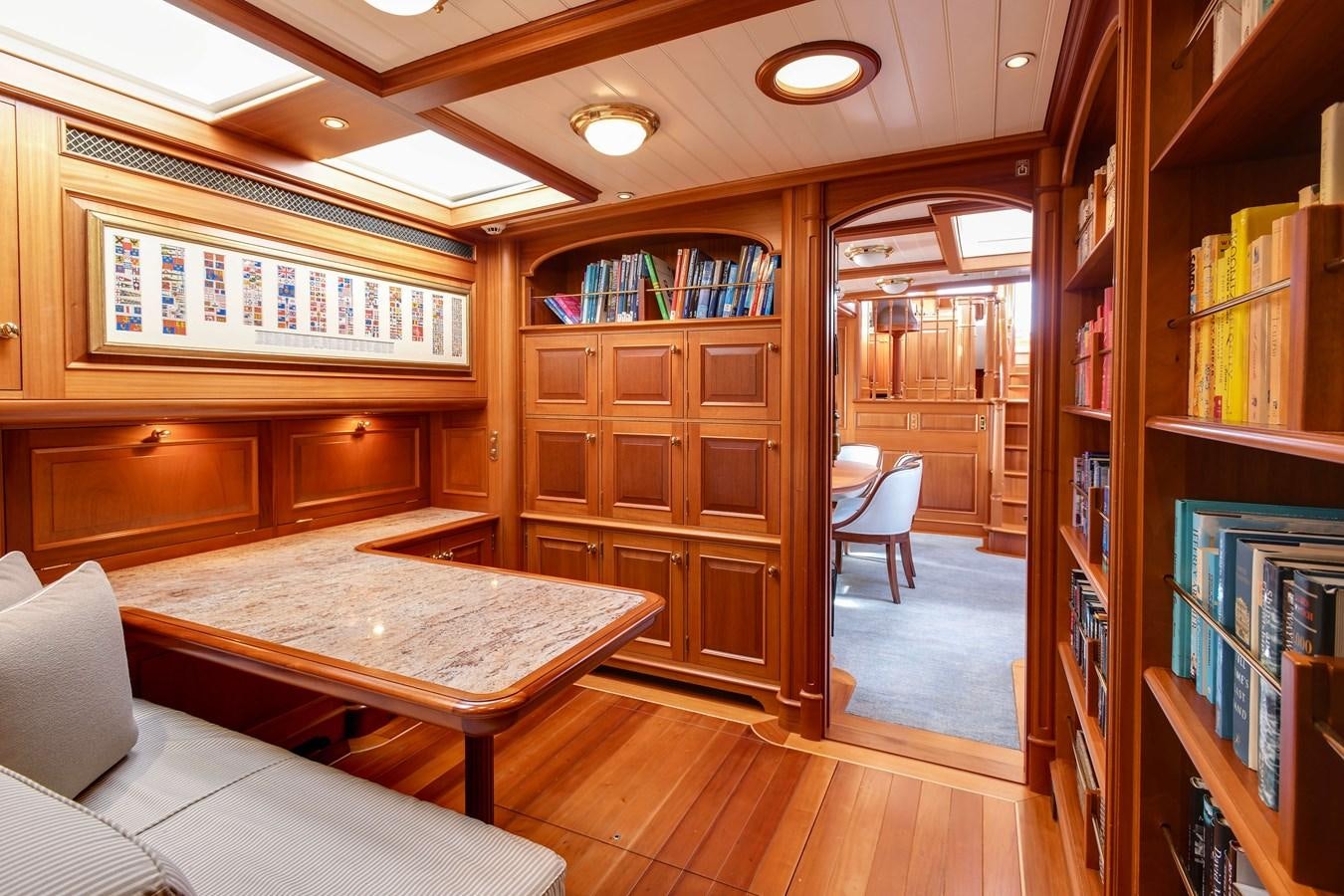 a room with a table and chairs aboard ANNE Yacht for Sale