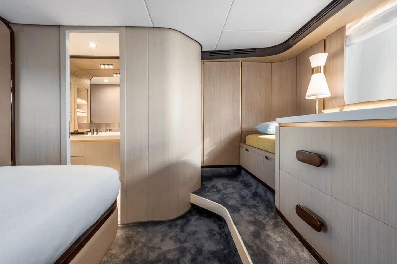 a room with a bed and a desk aboard 2023 AZIMUT FLY 78/56 Yacht for Sale