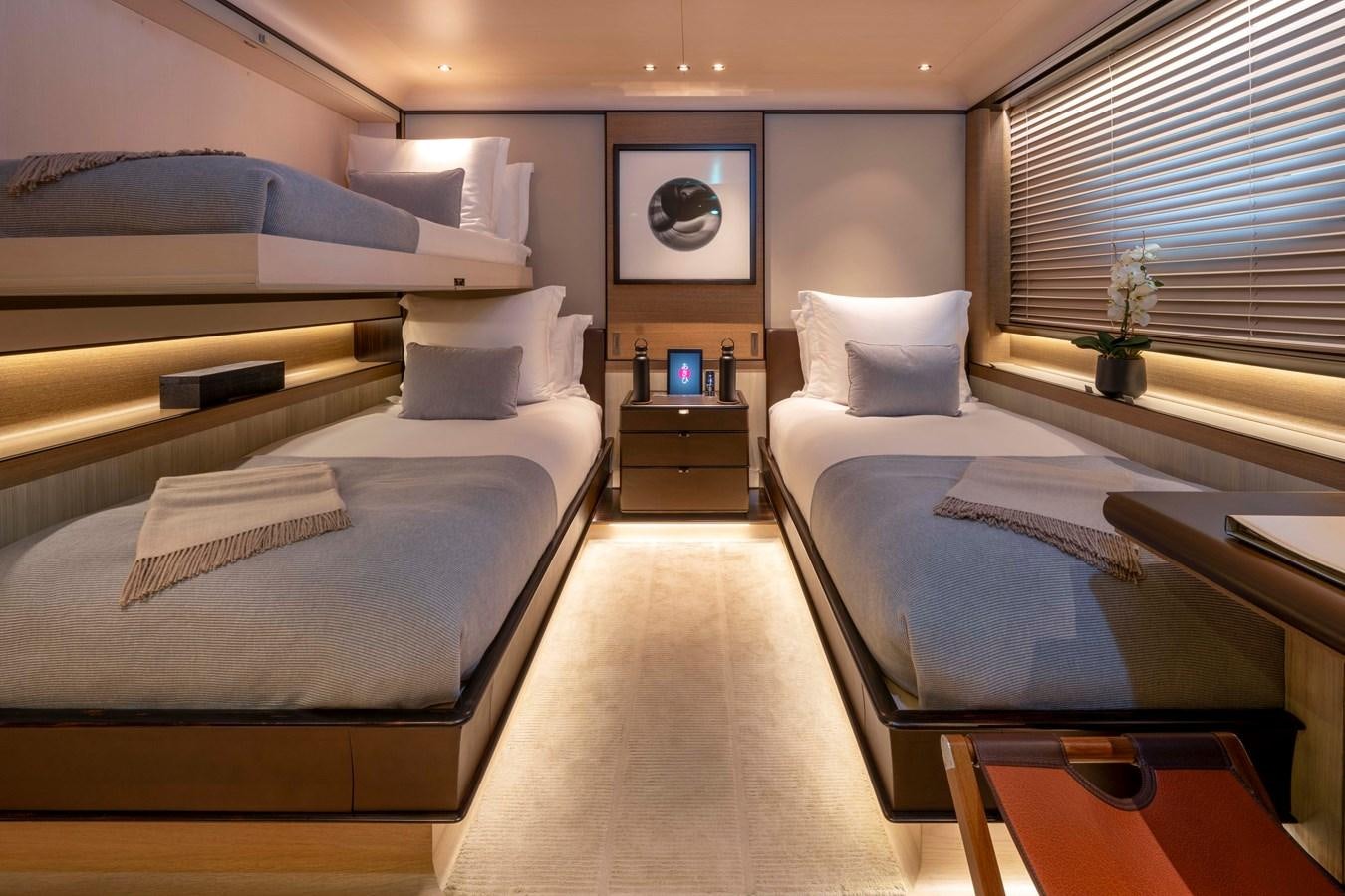 a room with a couple of beds aboard ASAHI Yacht for Sale