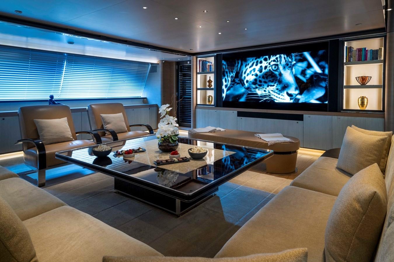 a living room with a large screen aboard ASAHI Yacht for Sale