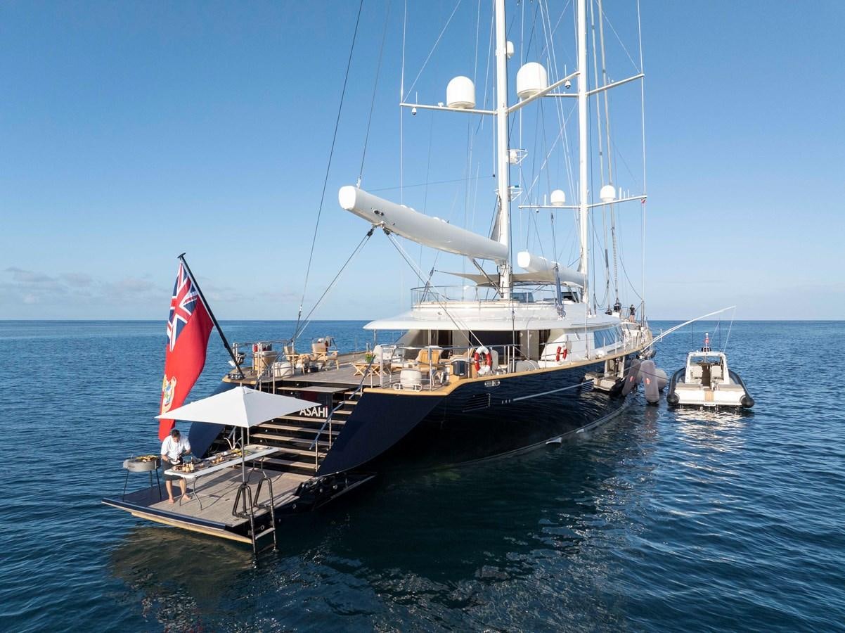 a boat with a flag on it aboard ASAHI Yacht for Sale