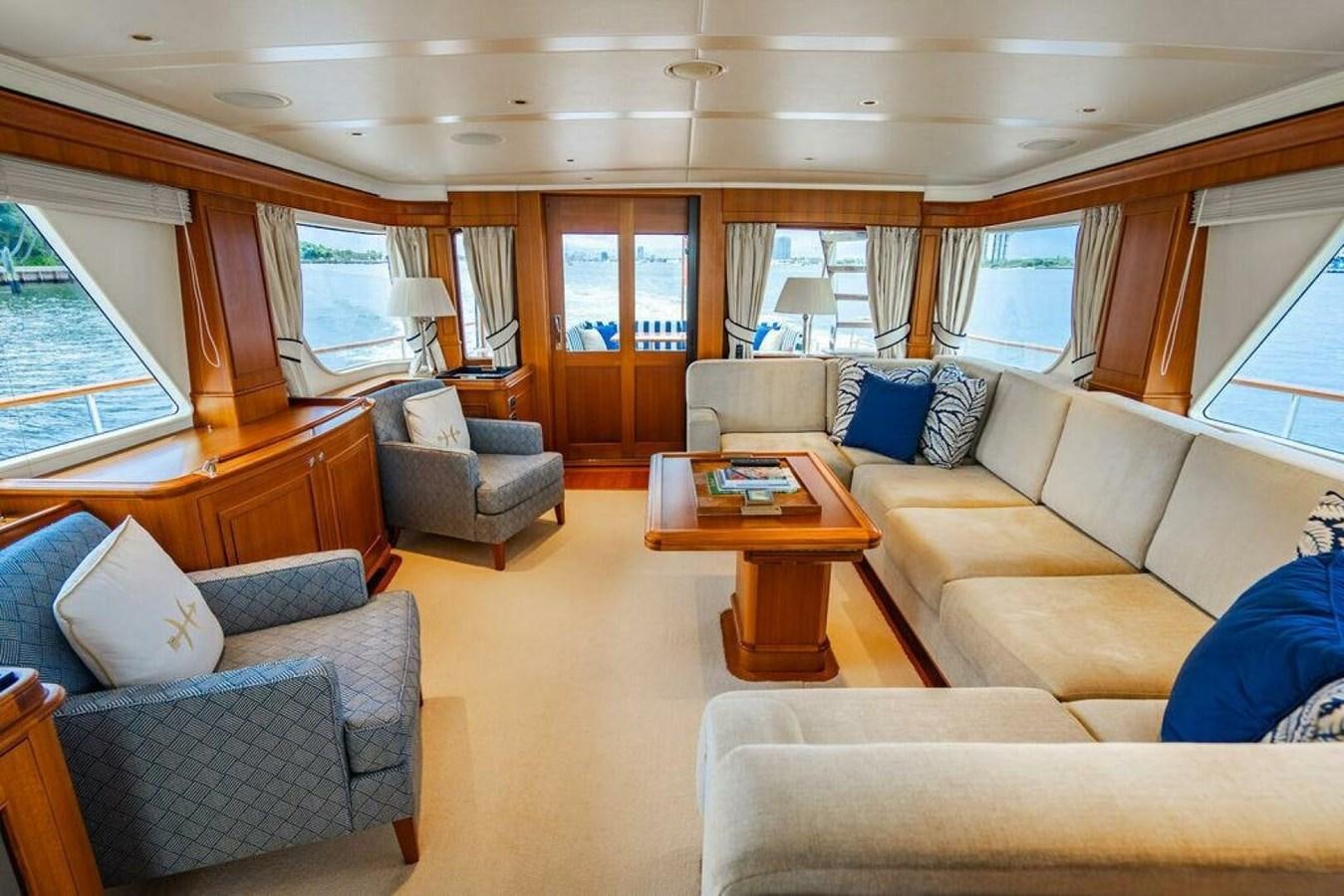 a living room with a couch and a coffee table aboard PHOEBE Yacht for Sale