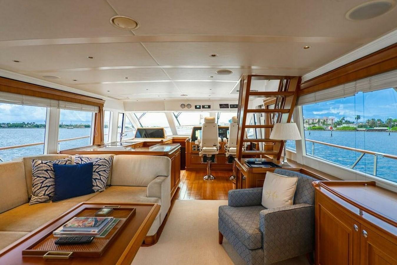 a living room with a couch and a coffee table aboard PHOEBE Yacht for Sale