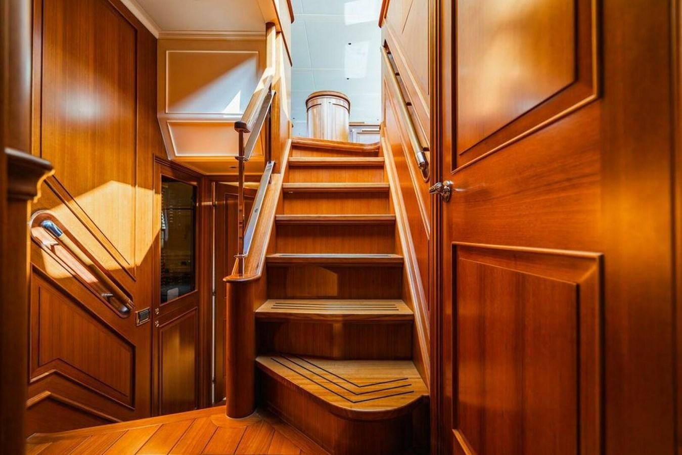 a wooden staircase in a house aboard PHOEBE Yacht for Sale