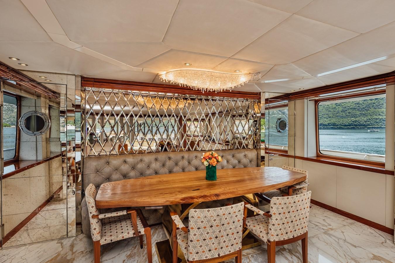 a dining table in a room aboard ZULU Yacht for Sale