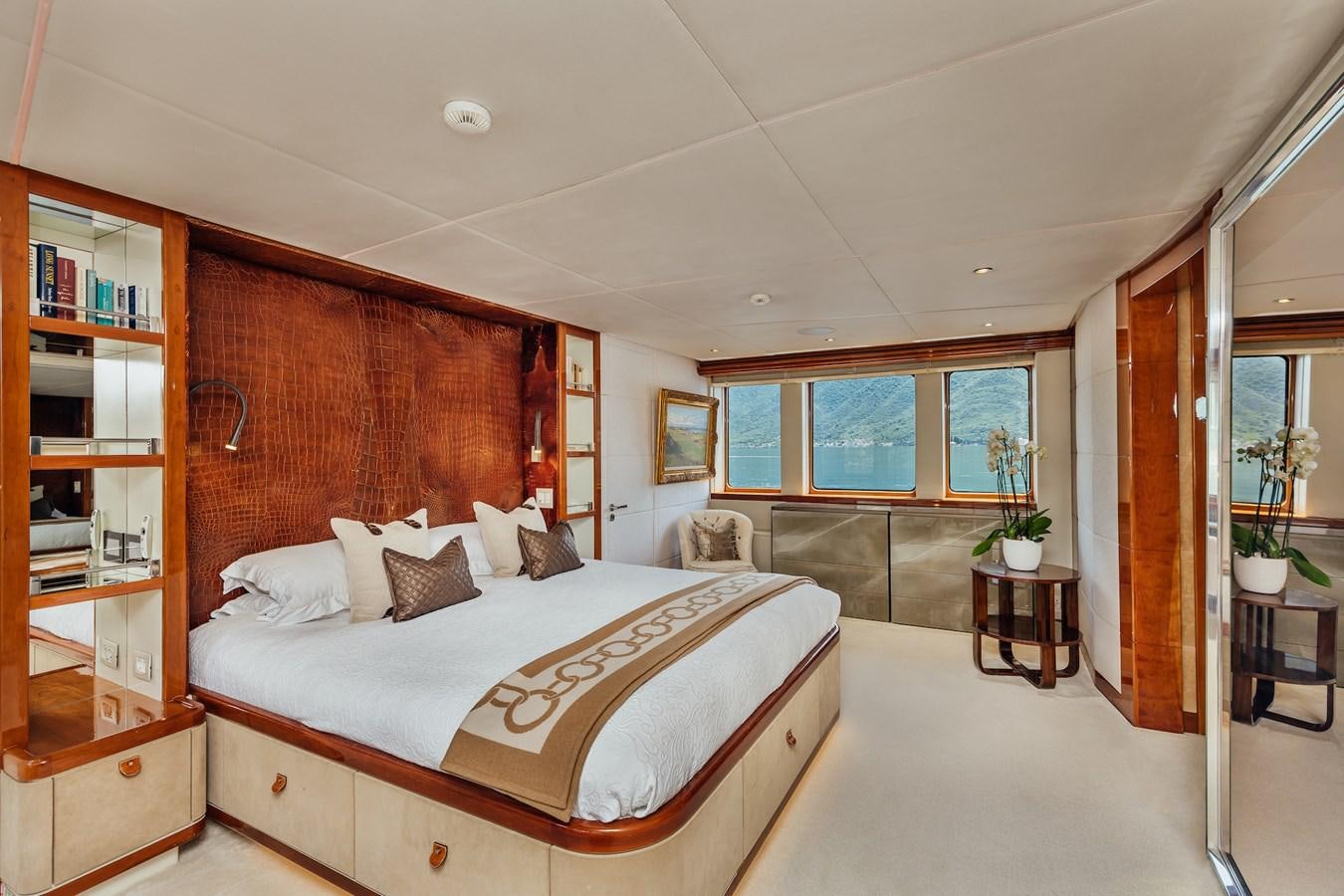 a bedroom with a large bed aboard ZULU Yacht for Sale