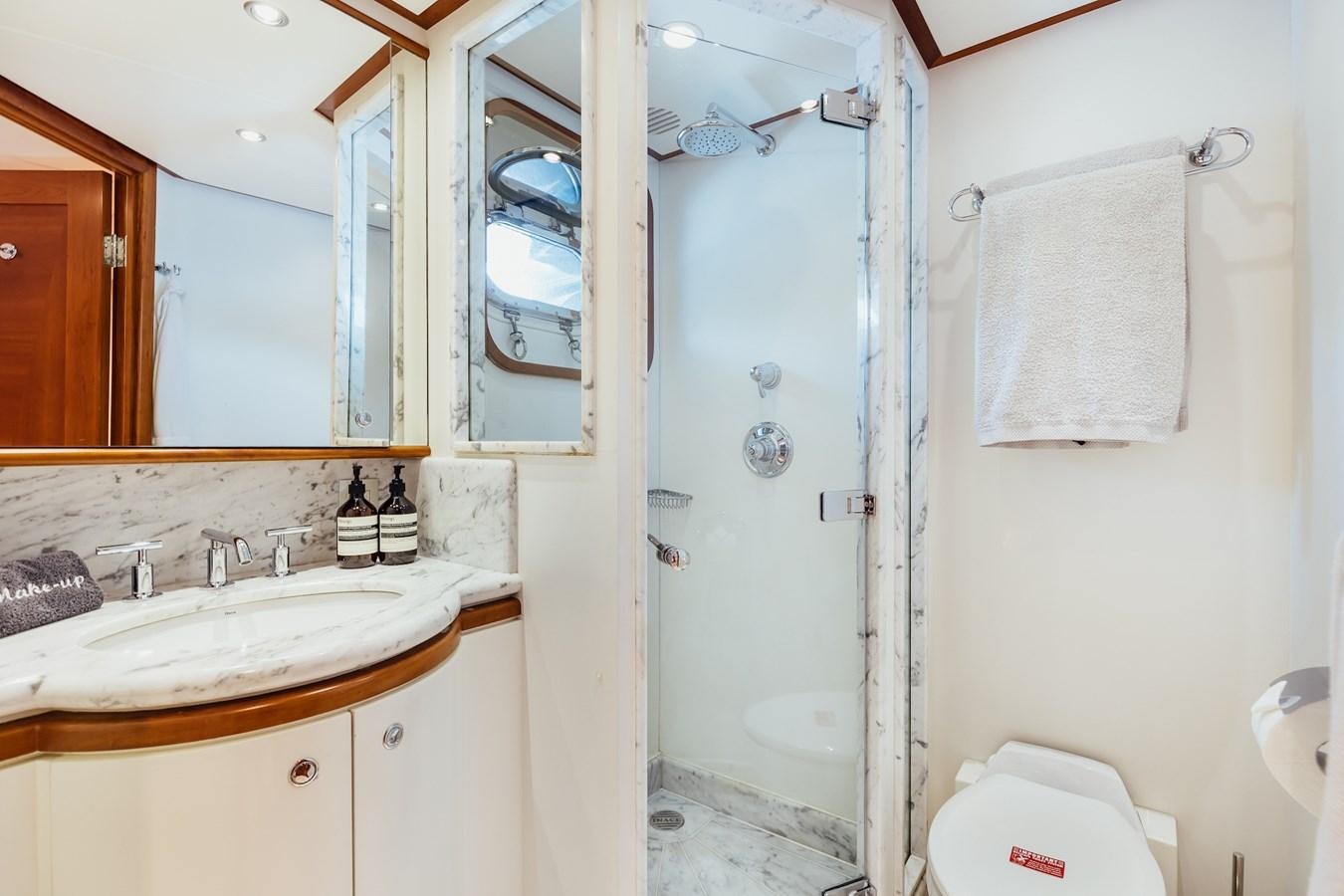 a bathroom with a shower and sink aboard ZULU Yacht for Sale
