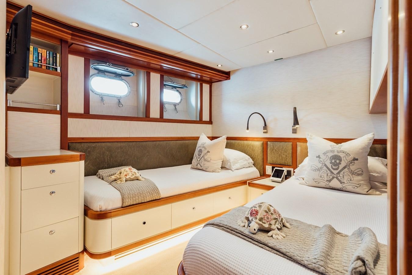 a couple of beds in a room aboard ZULU Yacht for Sale