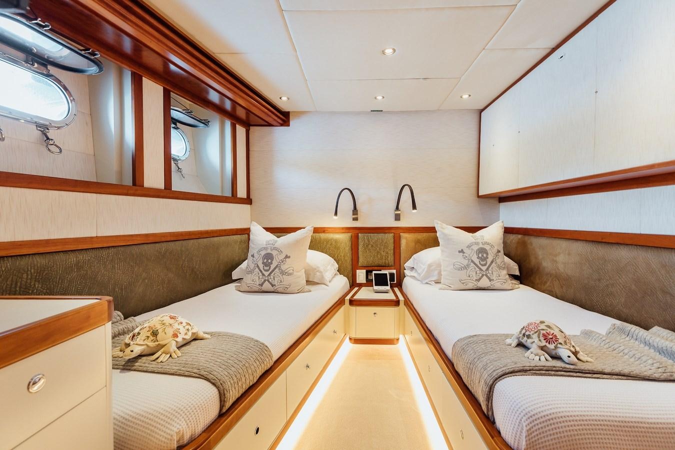 a room with two beds aboard ZULU Yacht for Sale