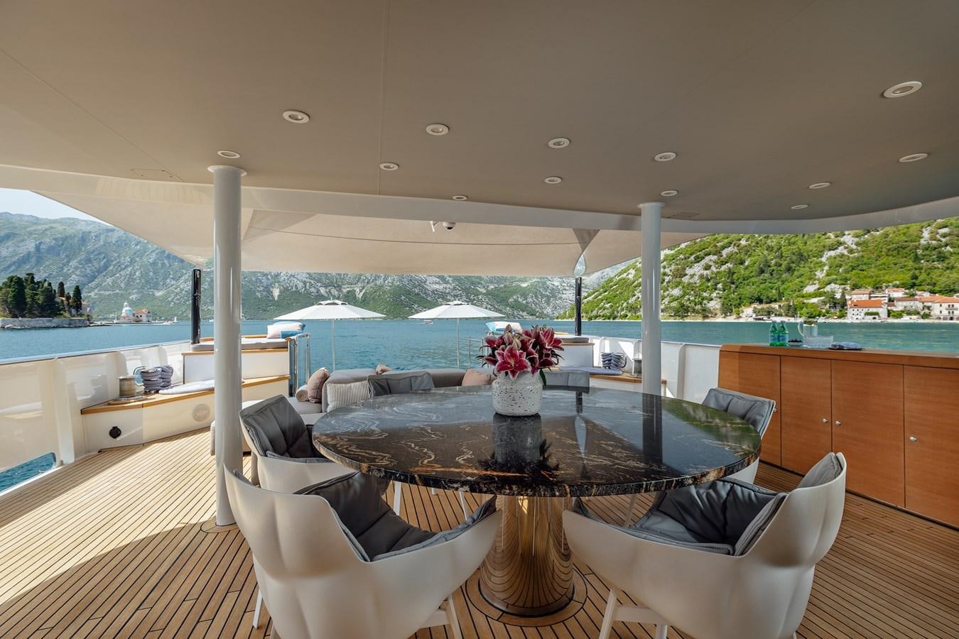 a living room with a large table and chairs aboard ZULU Yacht for Sale