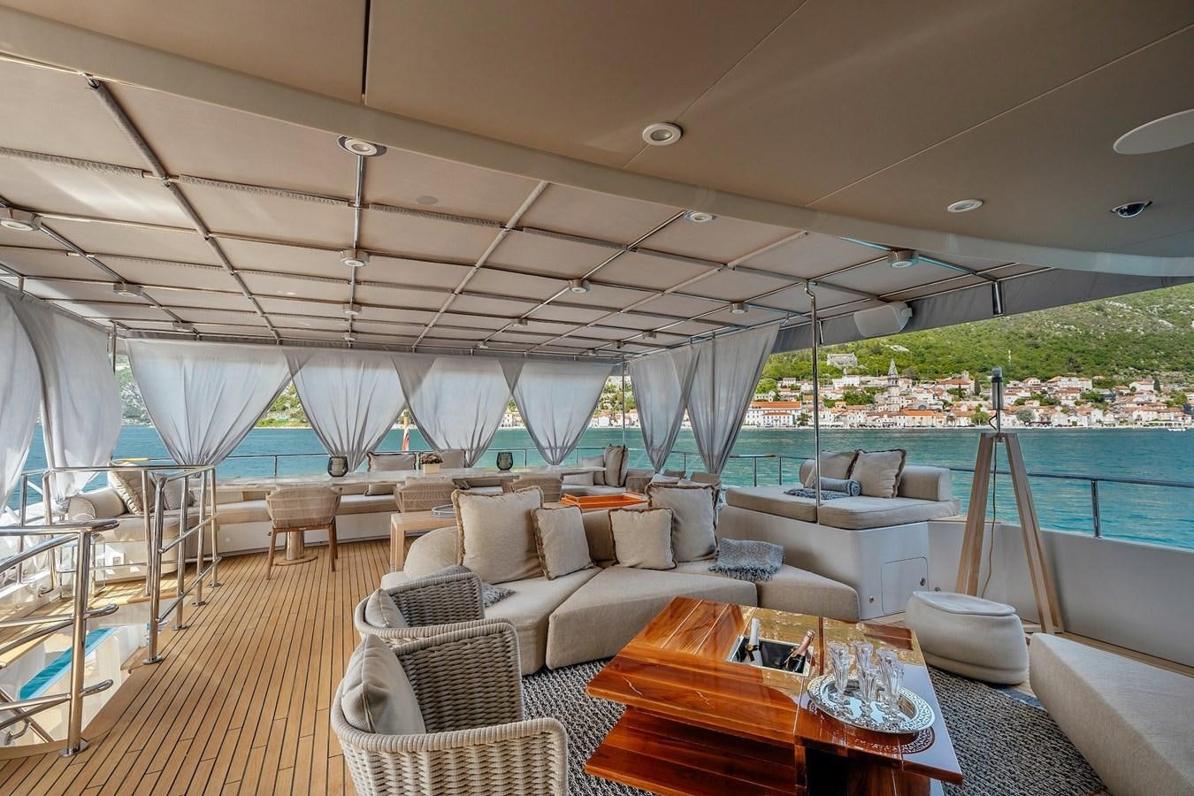 a large living room with a large balcony aboard ZULU Yacht for Sale