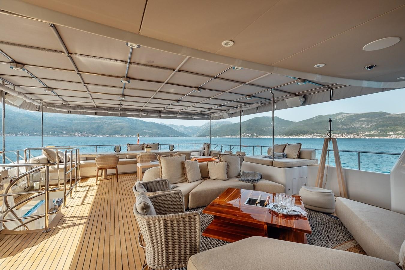 a large living room with a large balcony overlooking the ocean aboard ZULU Yacht for Sale