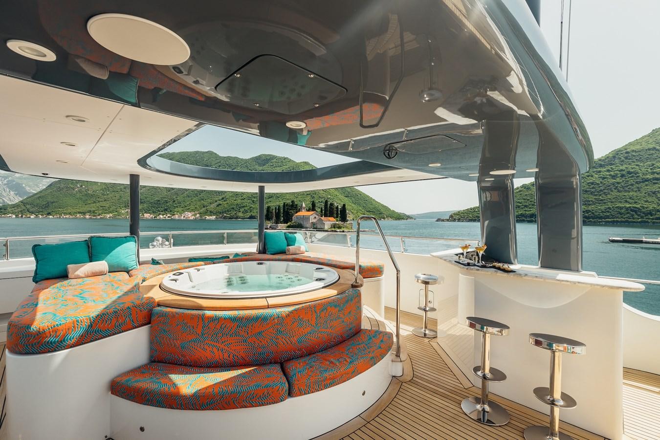 a room with a table and chairs aboard ZULU Yacht for Sale