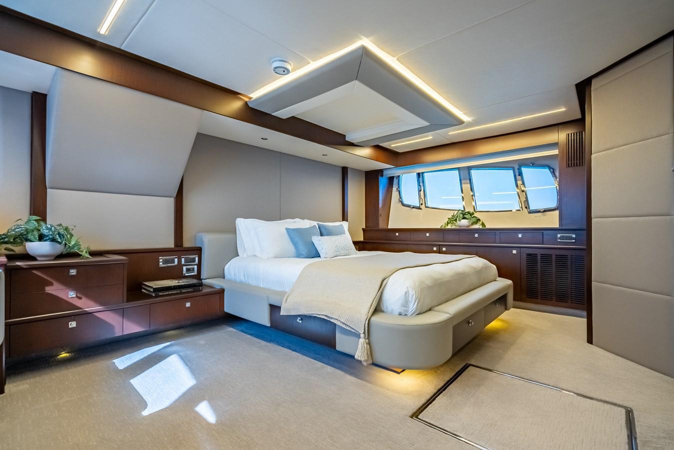 a room with a bed and a desk aboard MOZZ II Yacht for Sale