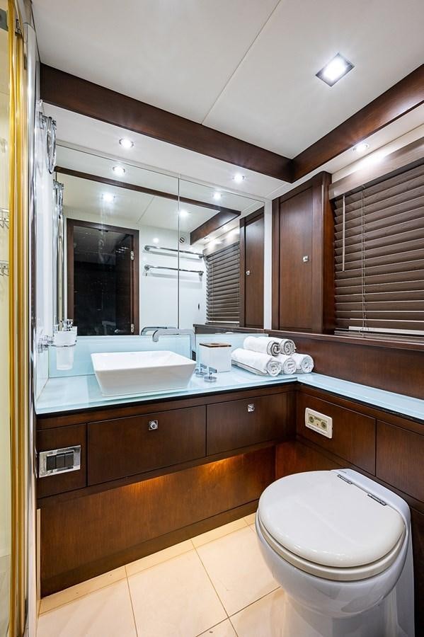 a bathroom with a large mirror aboard MOZZ II Yacht for Sale