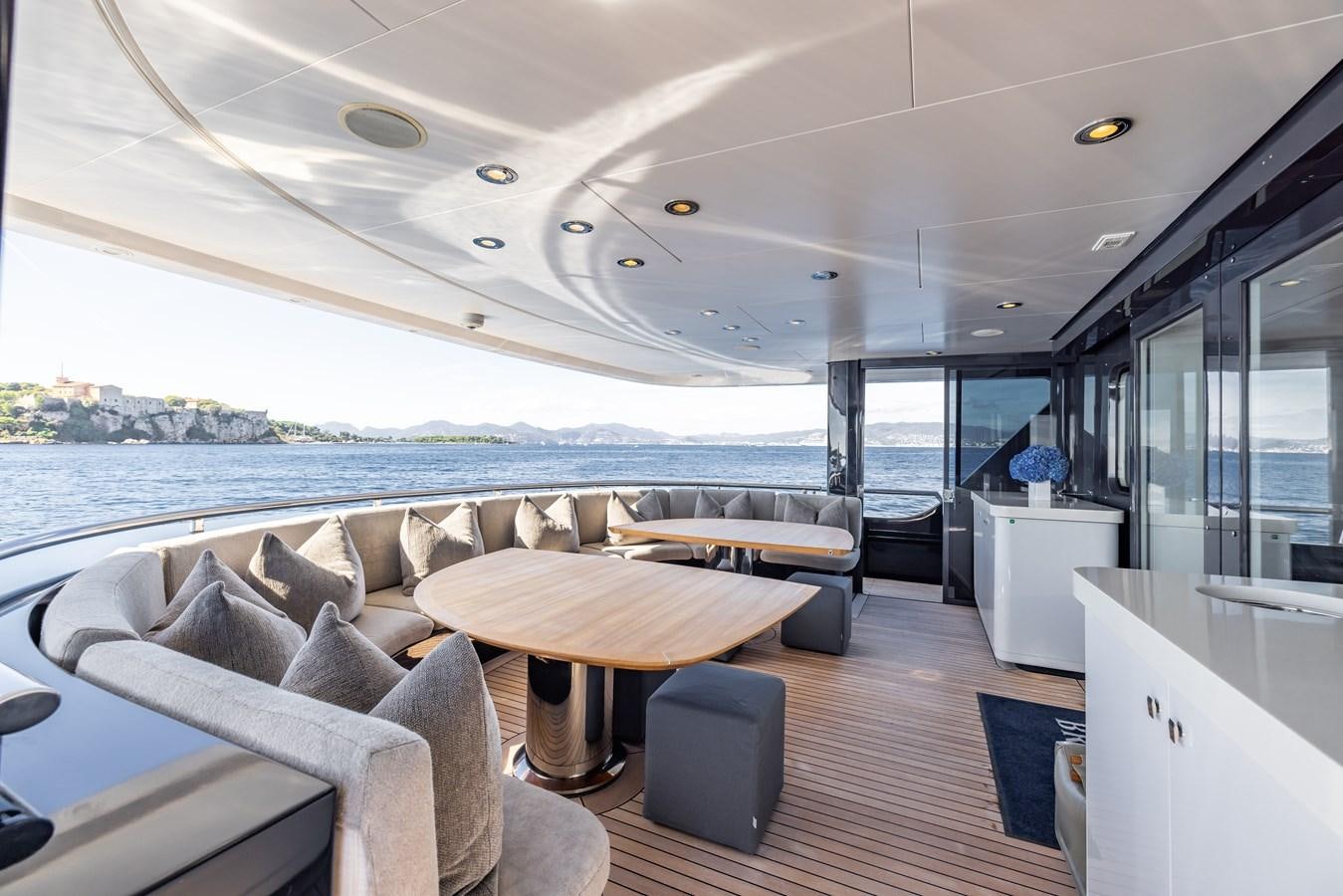 a boat with a table and chairs aboard BRAVADO Yacht for Sale