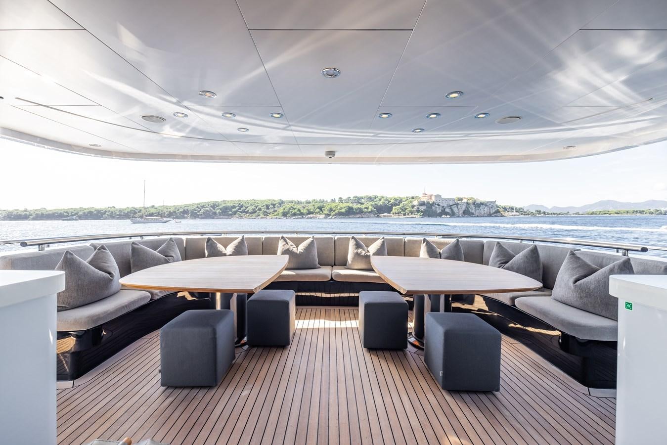 a room with couches and a table aboard BRAVADO Yacht for Sale