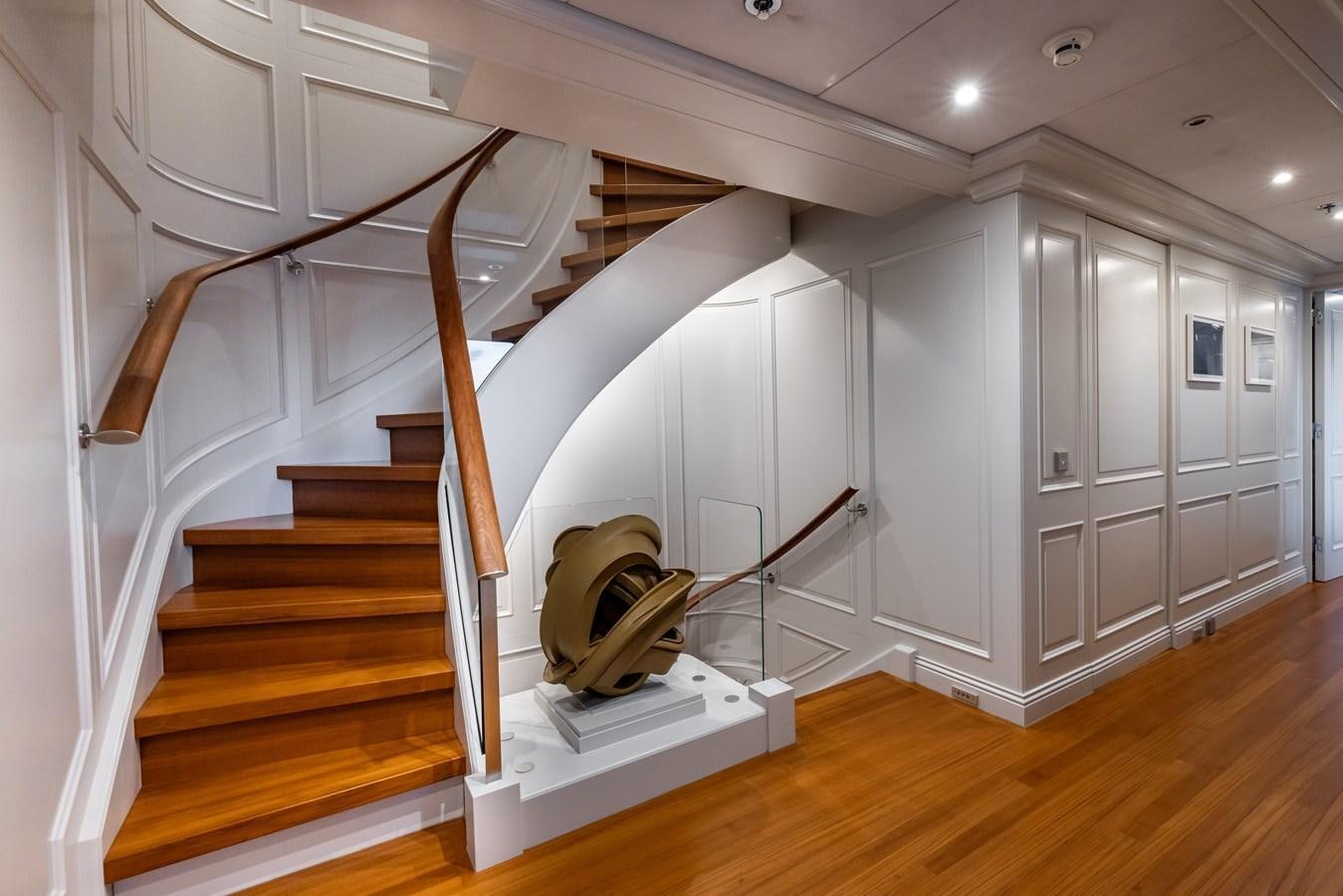 a white staircase in a house aboard BRAVADO Yacht for Sale