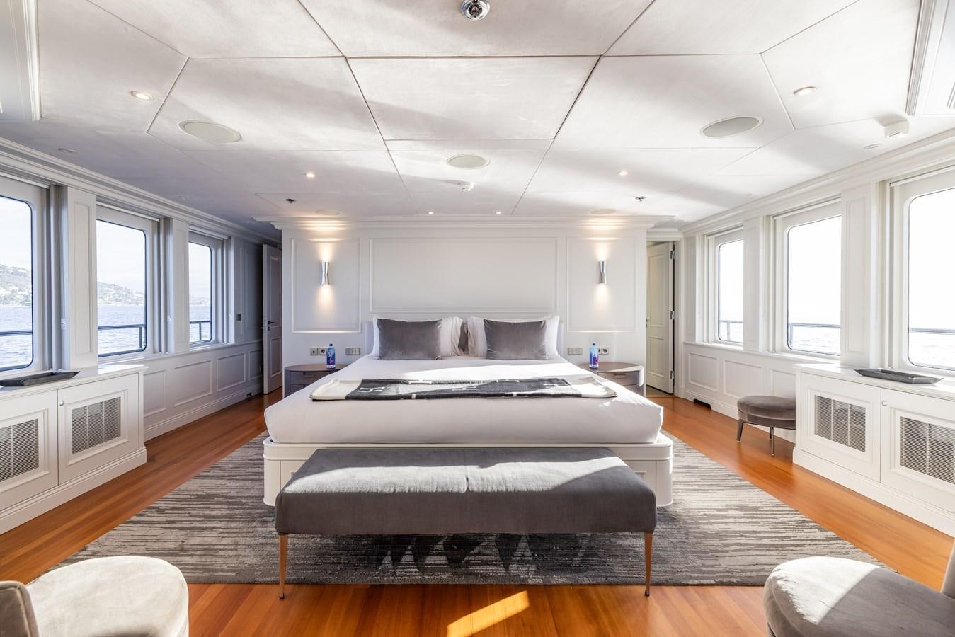 a large bedroom with a large bed aboard BRAVADO Yacht for Sale
