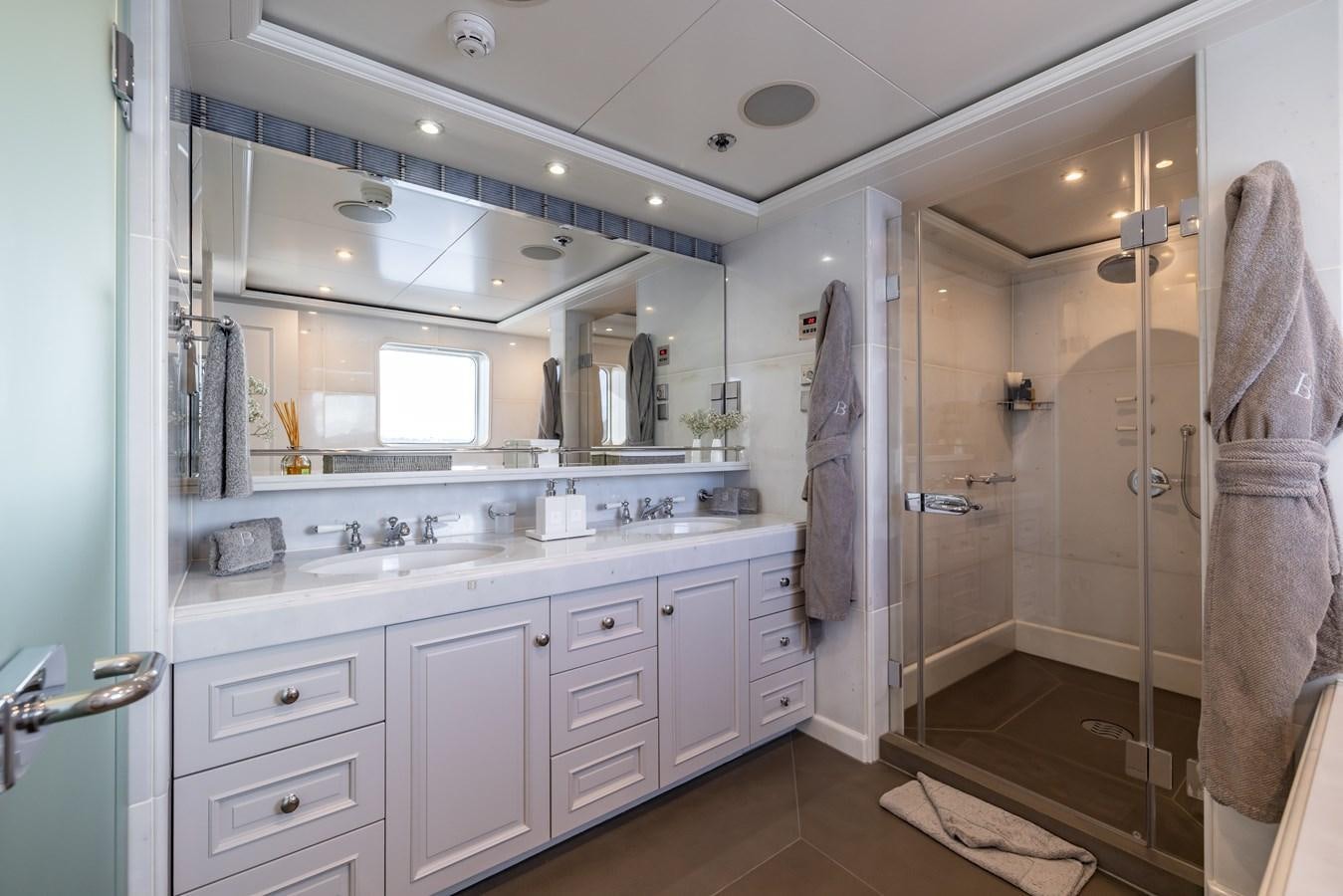 a bathroom with a shower and sink aboard BRAVADO Yacht for Sale