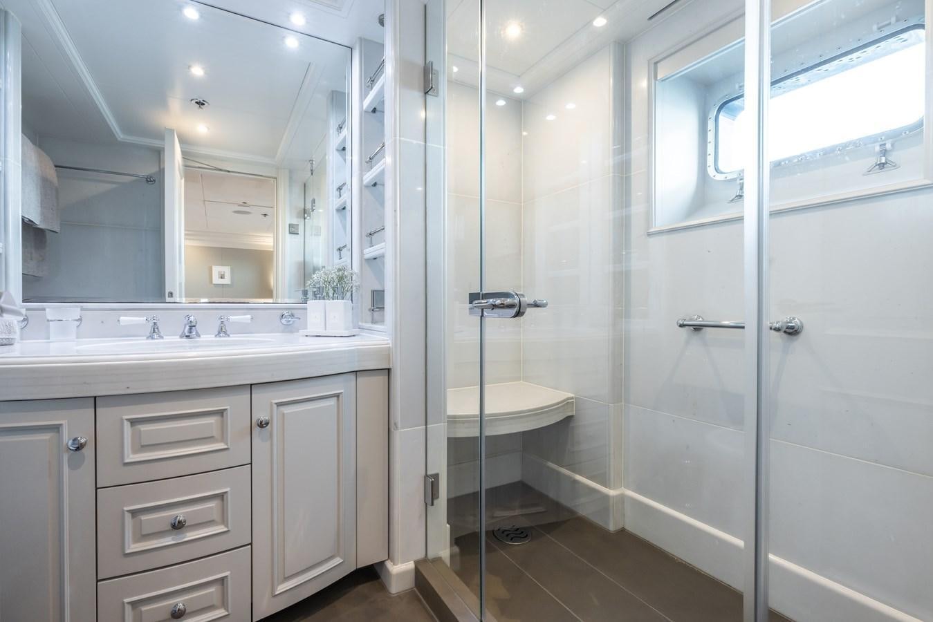 a bathroom with a stand up shower aboard BRAVADO Yacht for Sale