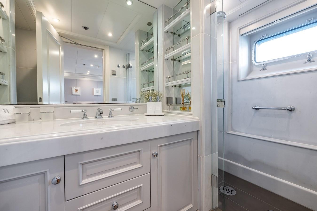 a bathroom with a large mirror aboard BRAVADO Yacht for Sale