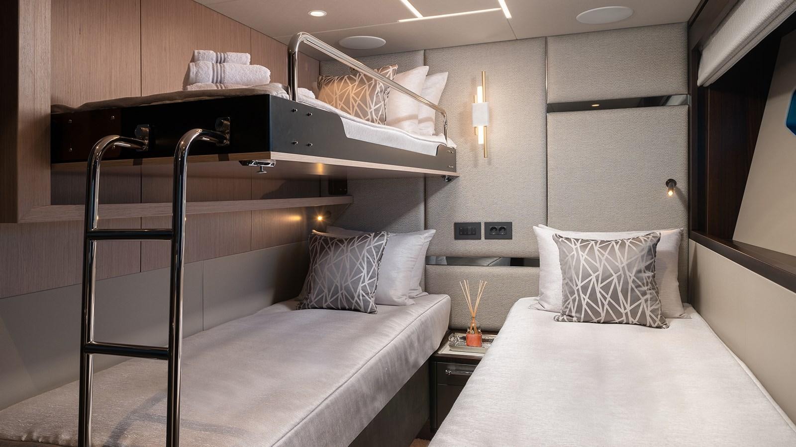 a bed with a white sheet aboard MOWANA Yacht for Sale