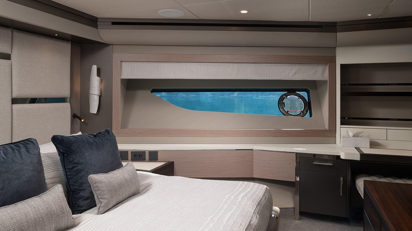a room with a bed and a tv aboard MOWANA Yacht for Sale