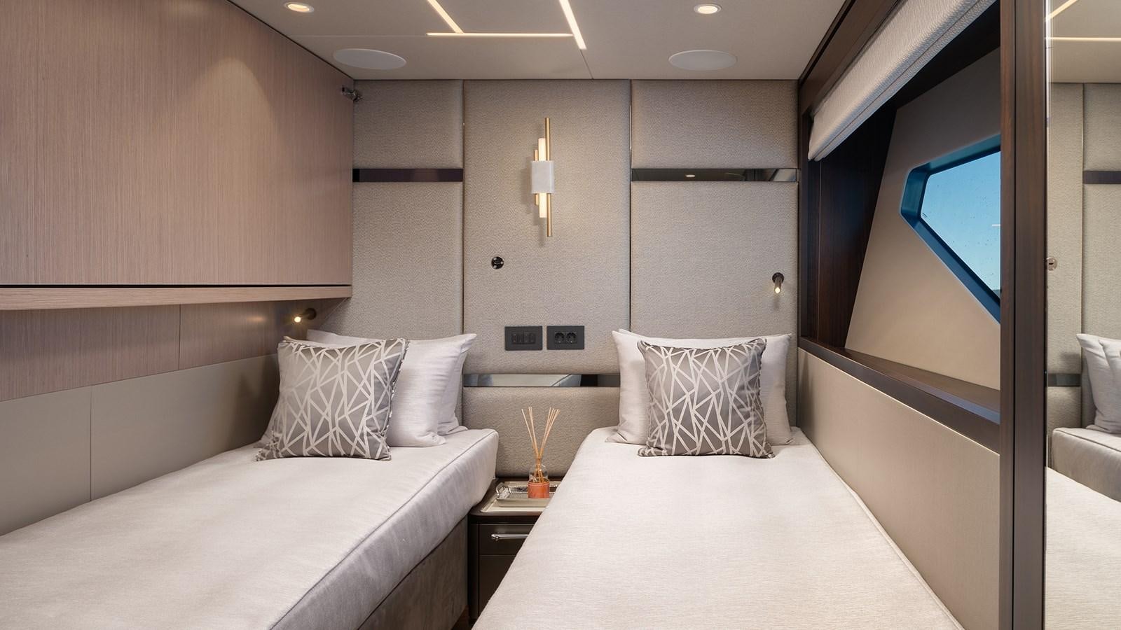 a room with two beds aboard MOWANA Yacht for Sale
