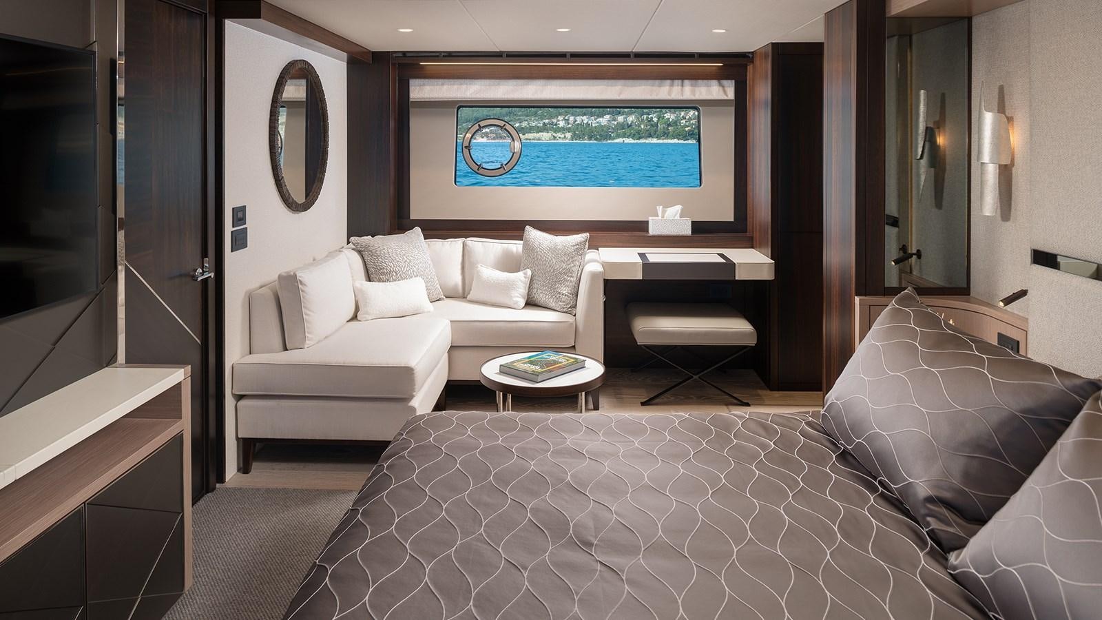 a living room with a large screen aboard MOWANA Yacht for Sale