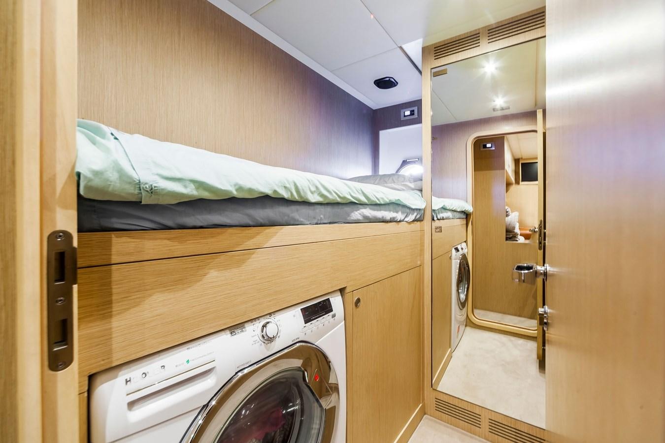 a bedroom with a bed and a closet aboard MINE Yacht for Sale