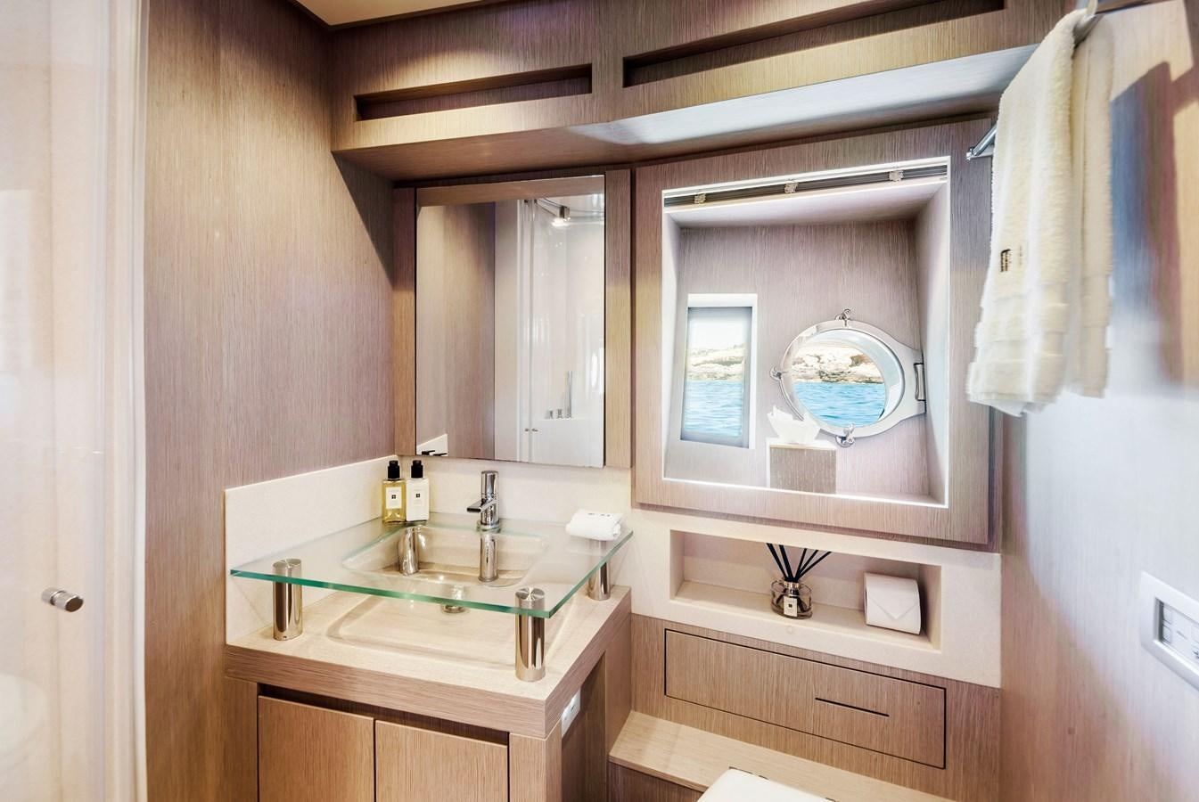 a bathroom with a sink and a mirror aboard MINE Yacht for Sale