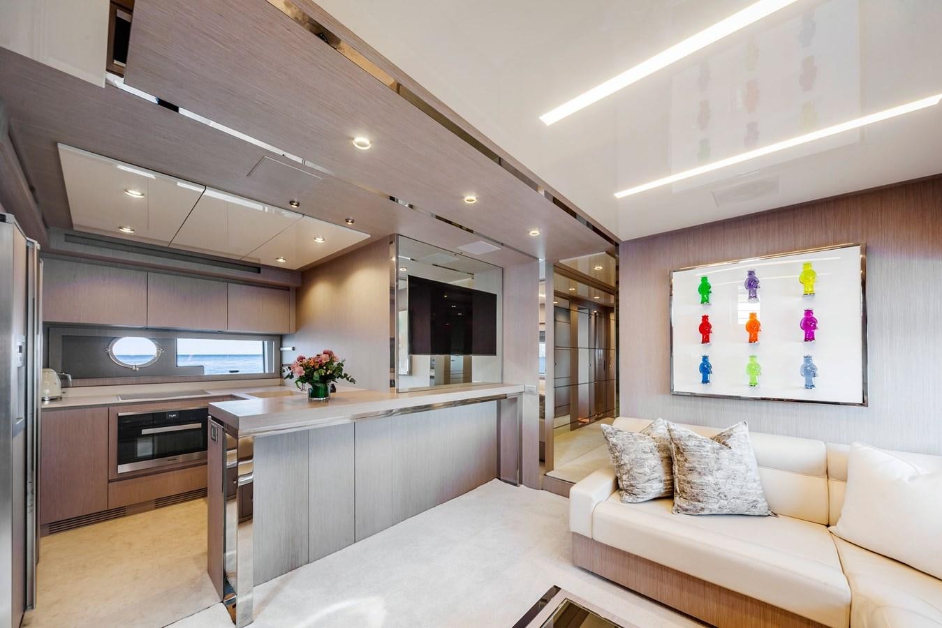 a modern kitchen with a large island aboard MINE Yacht for Sale