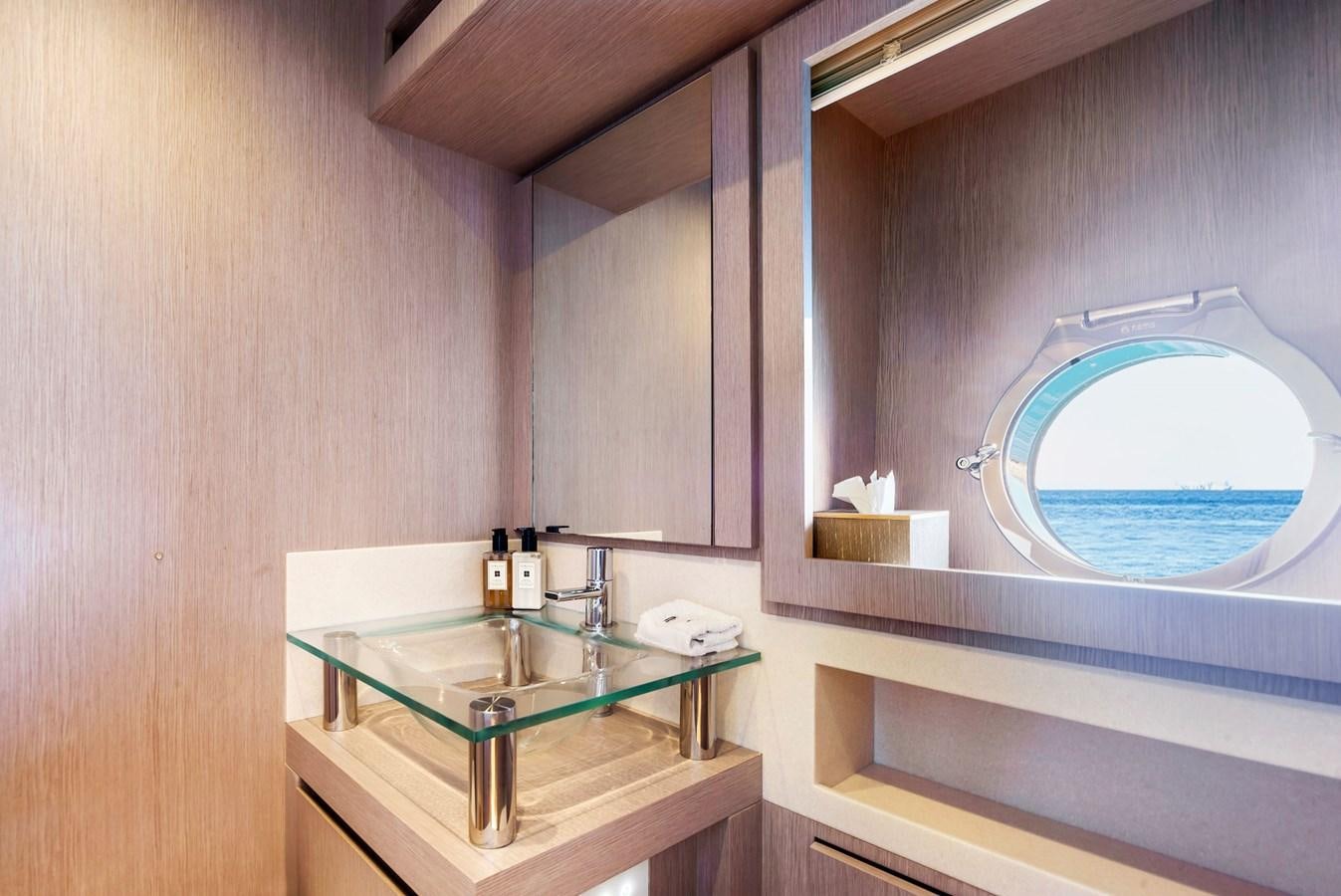 a bathroom with a large mirror aboard MINE Yacht for Sale