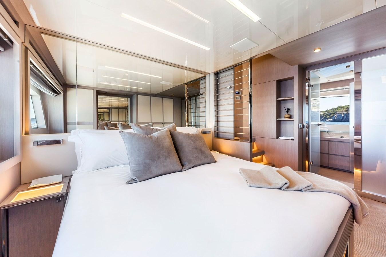 a large bed in a room aboard MINE Yacht for Sale