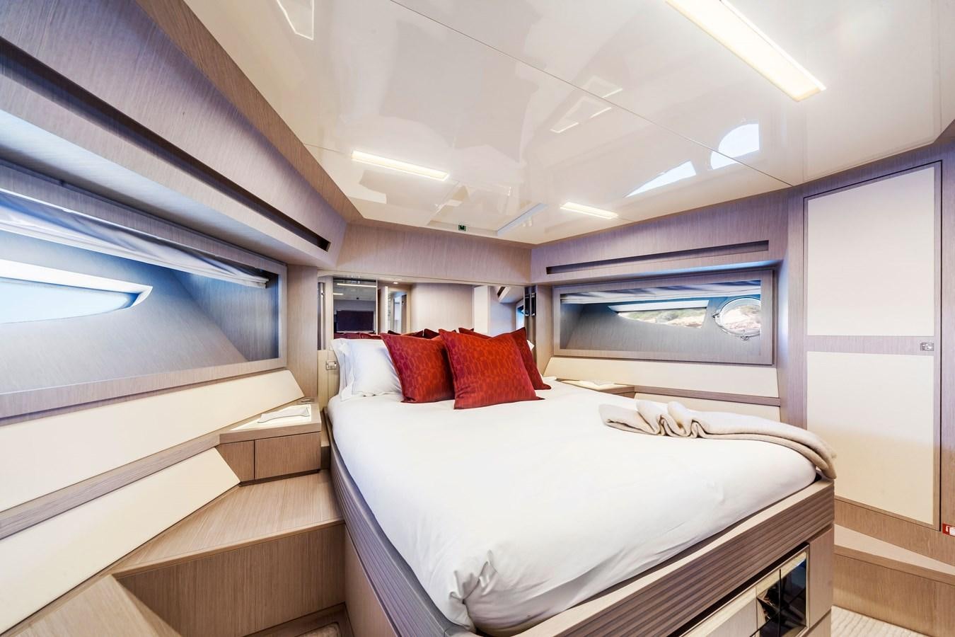 a room with a bed and a window aboard MINE Yacht for Sale
