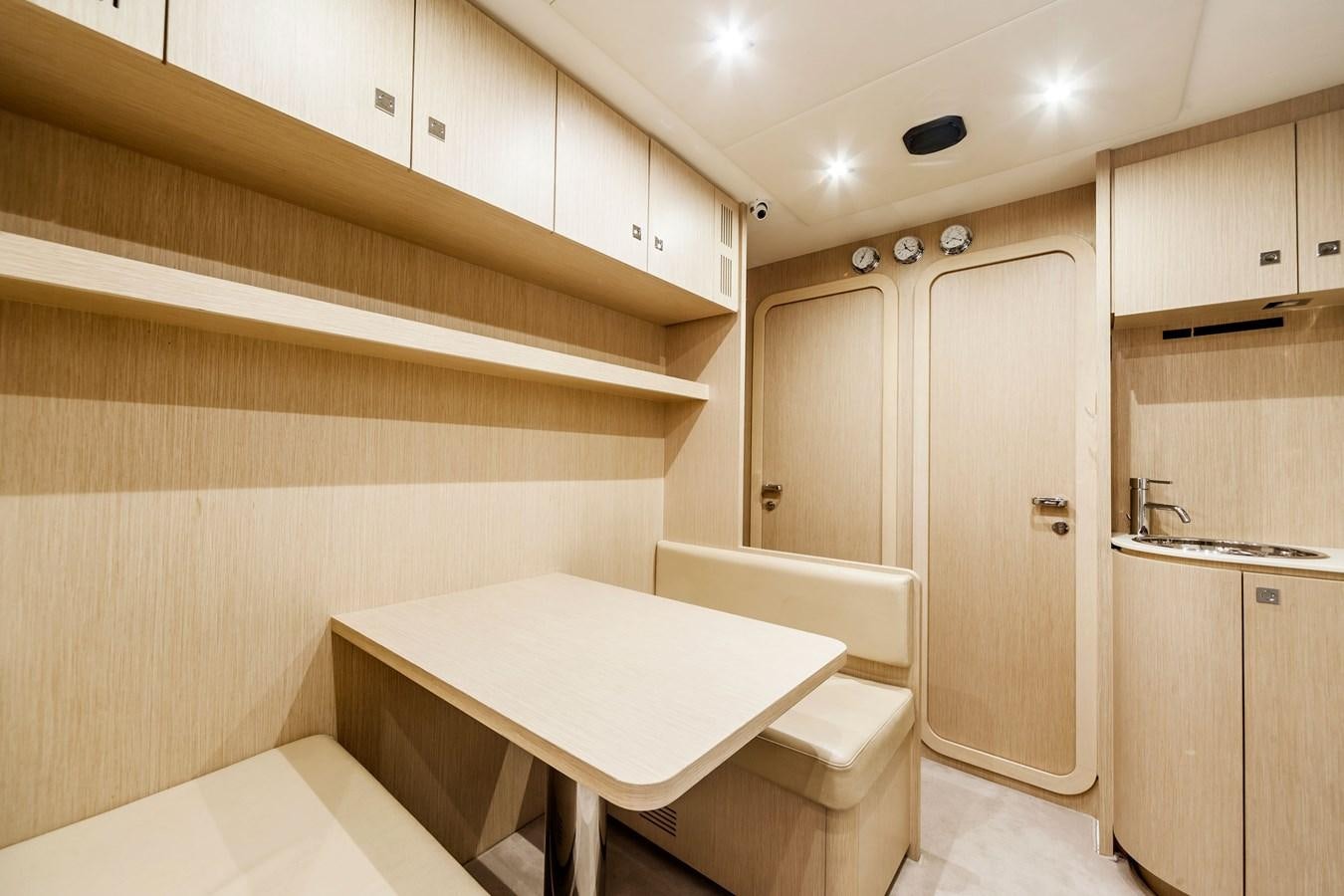 a bathroom with a table and a sink aboard MINE Yacht for Sale