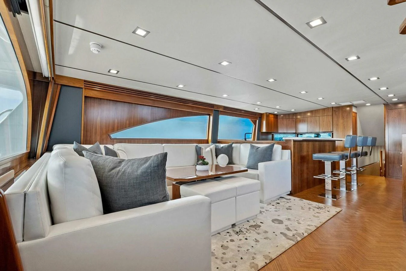 a living room with a large window aboard TEAM MAYHEM Yacht for Sale